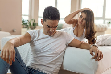 Obraz premium Young couple having relationship problems in the bedroom.