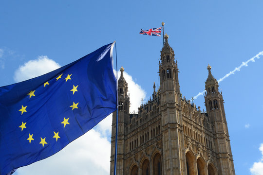 E.U. Flag flying in front of Union ack flag at Houses of Parliament London