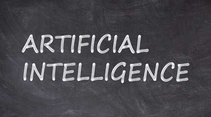 Obraz premium Artificial intelligence written on blackboard