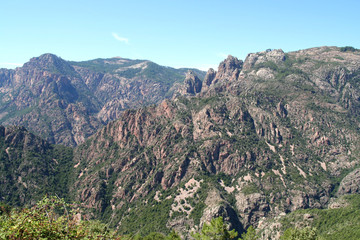 Fototapeta na wymiar Rugged mountains of the interior along the Gorgesde Spelunca in central Corsica.