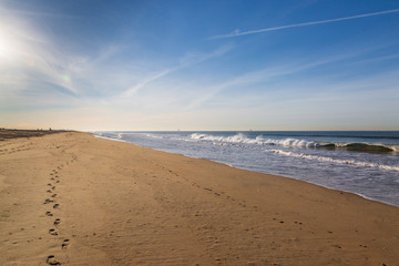 Looking along the wide sandy beach, at Sunset Beach on the Californian Coast