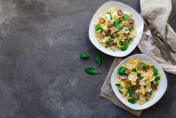 Farfalle pasta with mushrooms and spinach