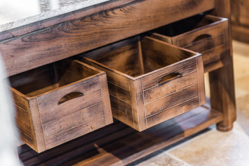Retro designed wooden commode in kitchen interior