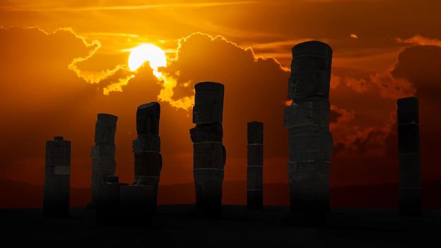 Atlantean columns or Toltec warriors on Pyramid of Quetzalcoatl in Ancient ruins of Tula de Allende, Sunset time lapse in Mesoamerican archeological site, capital of the Toltec Empire, Mexico
