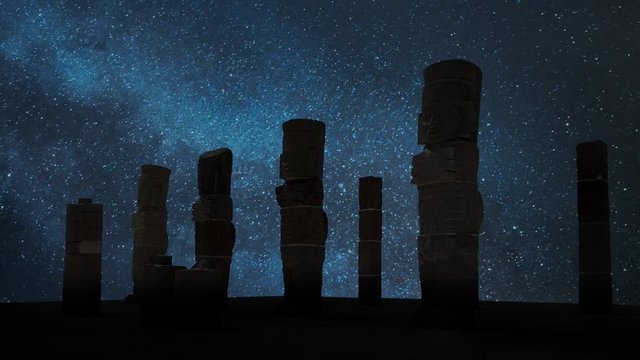 Atlantean columns or Toltec warriors on Pyramid of Quetzalcoatl in Ancient ruins of Tula , Night with Stars, capital of the Toltec Empire, Mexico