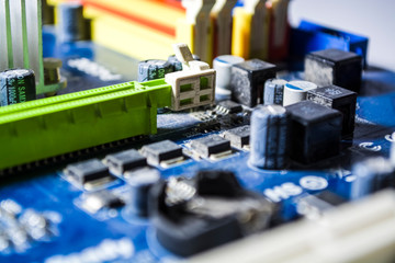 The blue motherboard and details, old and with dust from the personal computer. Repair. Texture or background. Workshop. 