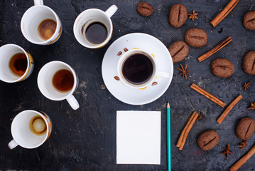 Delicious and fragrant coffee in the form of coffee, with grains of coffee. Cups of coffee in...