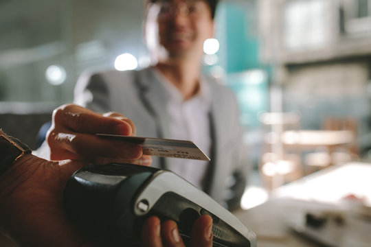 Businessman paying with contactless credit card