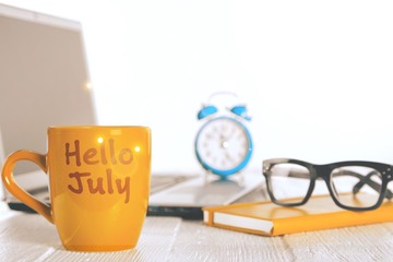 Newspapers with glasses and laptop. Online news.