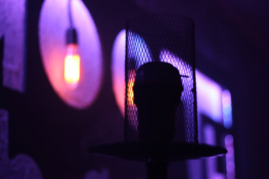 Edison incandescent lamps. Warm light. Night lighting of the institution. Purple Scythian in the background. Cafe. Bar. Artistic photos with hookan.