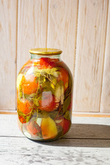 Canned tomatoes and cucumbers with fresh vegetables