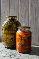 Canned tomatoes and cucumbers with fresh vegetables