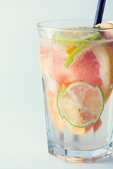 Fresh grapefruit cocktail. Fresh summer cocktail with grapefruit and ice cubes. Glass of cold grapefruit mojito