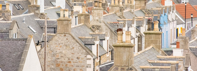 Old croft houses in Cullen, fishing village on Moray Firth, Scotland. Cullen Viaduct in the...
