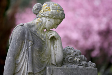 Obraz premium statue of sorrow at municipal cemetery in Amsterdam at springtime, The Netherlands