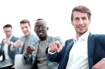 group of successful young men pointing their fingers at you