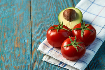 Breakfast food with fresh avocado and tomatoes, close-up.