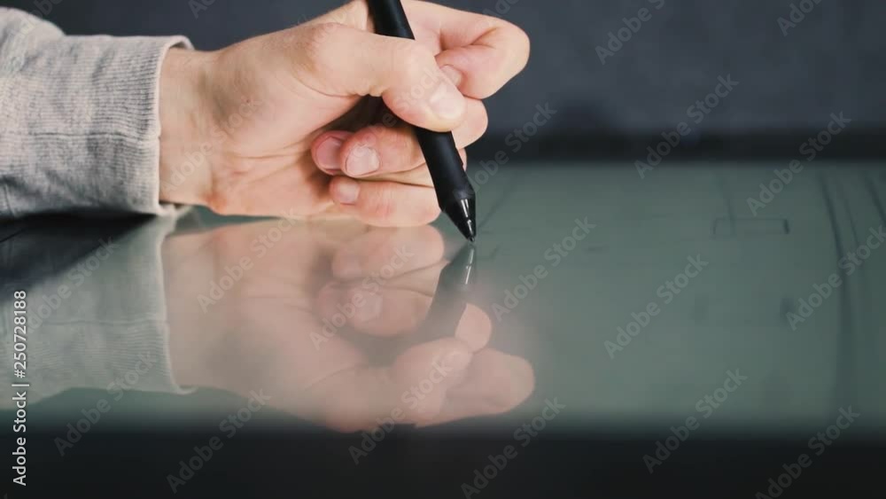 Wall mural engineer designer using tablet pc while working creative session with blueprints