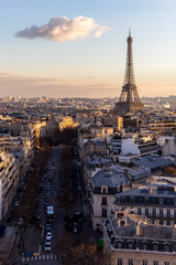 Magnificent look from Arc de Triomphe (Triumphal Arc) towards the Eiffel tower before sunset, with one clouds next to the tower