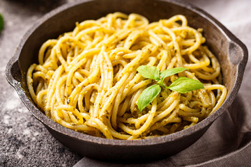 Italian spaghetti pasta with pesto sauce