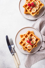 Waffles with strawberries and banana