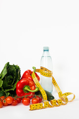 Healthy food for diet, vegetables with measurement tape. Copy space