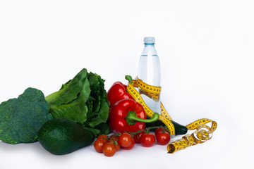 Healthy food for diet, vegetables with measurement tape on white background.