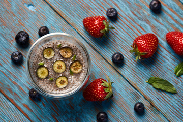 Fresh smoothie with passion fruit with currant and strawberries, close-up