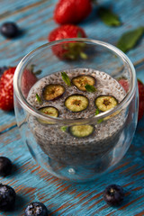 Fresh smoothie with passion fruit with currant and strawberries, close-up