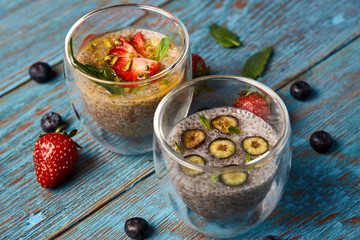 Fresh smoothie with passion fruit with currant and strawberries, close-up