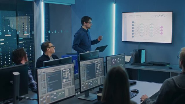 Team of Professional IT Developers Have Meeting, Speaker Talks about New Blockchain Based Software Development Shown on TV. Concept: Deep Learning, Artificial Intelligence, Data Mining, Neural Network