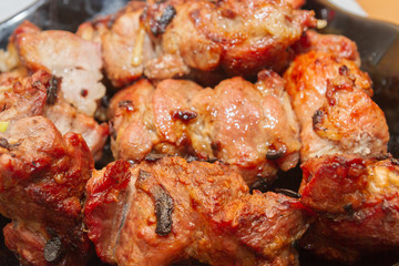 Delicious appetizing shish kebab of pork meat is in the plate