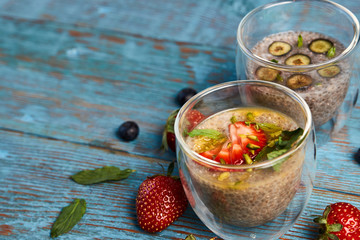 Fresh smoothie with passion fruit with currant and strawberries, close-up