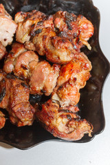 Delicious appetizing shish kebab of pork meat is in the plate