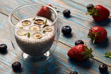 Fresh smoothie with passion fruit with currant and strawberries, close-up