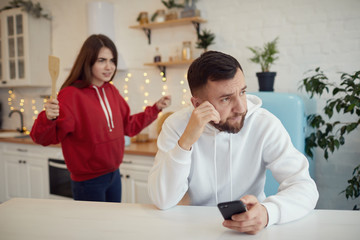 Fototapeta premium woman abused her husband in the kitchen