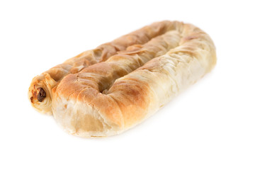 Placinta cake filled with a soft cheese. Isolated on a white background.
