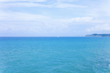 Beautiful blue sea with blue sky background. Holiday concept image with blue sea