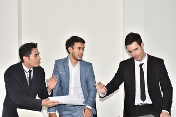 A group of young business people are meeting and having fun. And sometimes stressful