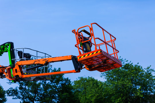 Elevating crane basket for engeneer. Industry concept with construction site elevating crane