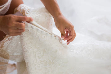 bride trying on the wedding dress