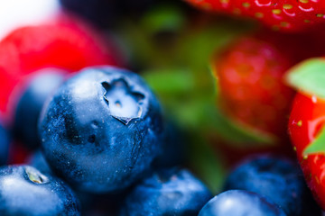 Raspberry blackberry and strawberries served on the plate. Nature and food concept image with fresh fruits on the plate