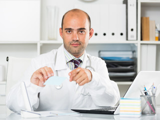 Male working in medical Center at the laptop