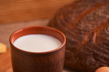 Assorted dairy products milk, cheese, eggs. rustic still life on table