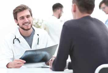 Fototapeta premium doctors discuss with the patient the x-ray