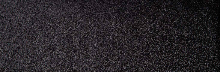 Silver sequins pattern. Sparkling sequins on black wool fabric as background