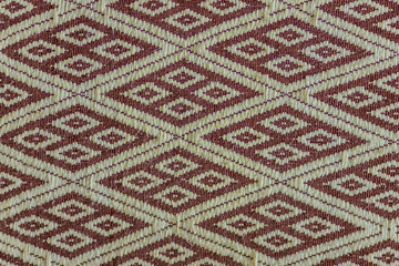 Beautiful pattern on Northern Thai silk fabric textile in the public night market. Thai silk fabric textured background.