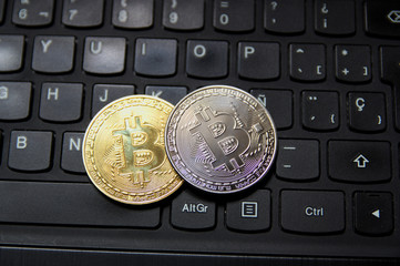 Bitcoin coins on a keyboard