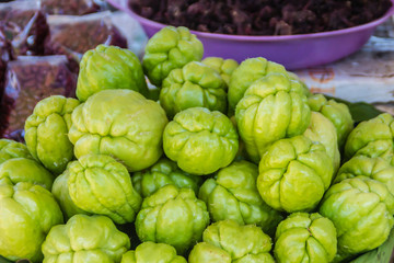 Organic Chayote fruits for sale in the market. Chayote (Sechium edule) is an edible plant that also...