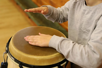 plays the drum, hands of the child
